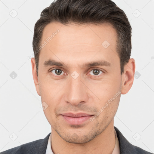 Joyful white young-adult male with short  brown hair and brown eyes