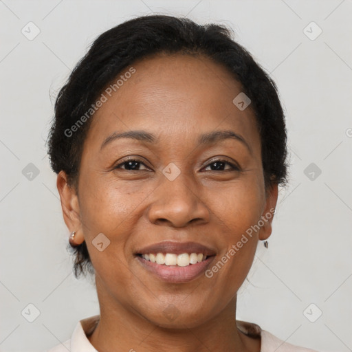 Joyful latino adult female with short  brown hair and brown eyes