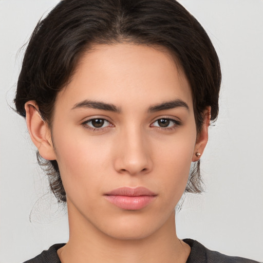 Neutral white young-adult female with medium  brown hair and brown eyes