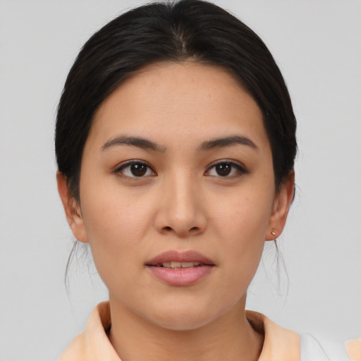Joyful asian young-adult female with medium  brown hair and brown eyes