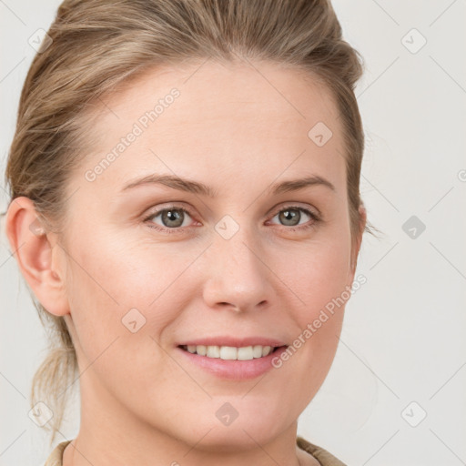 Joyful white young-adult female with medium  brown hair and blue eyes