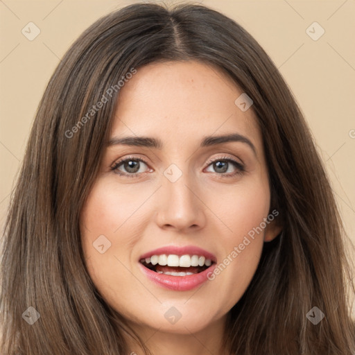 Joyful white young-adult female with long  brown hair and brown eyes