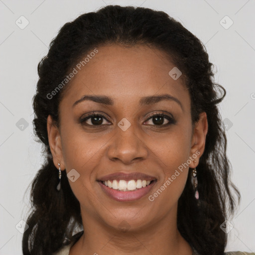 Joyful black young-adult female with long  brown hair and brown eyes