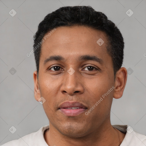 Neutral latino young-adult male with short  black hair and brown eyes