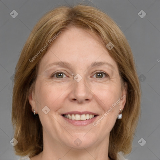 Joyful white adult female with medium  brown hair and grey eyes