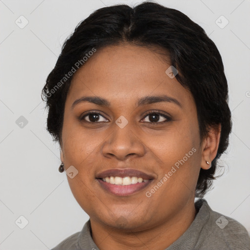 Joyful black young-adult female with long  brown hair and brown eyes