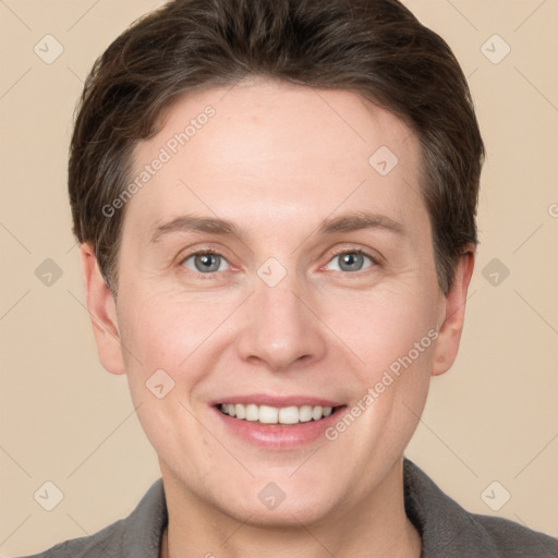 Joyful white adult female with short  brown hair and grey eyes