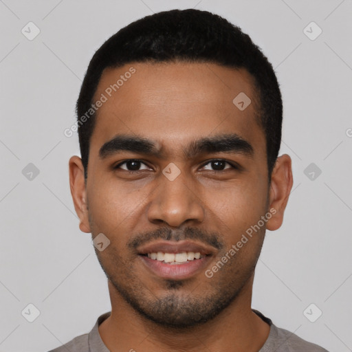 Joyful latino young-adult male with short  black hair and brown eyes