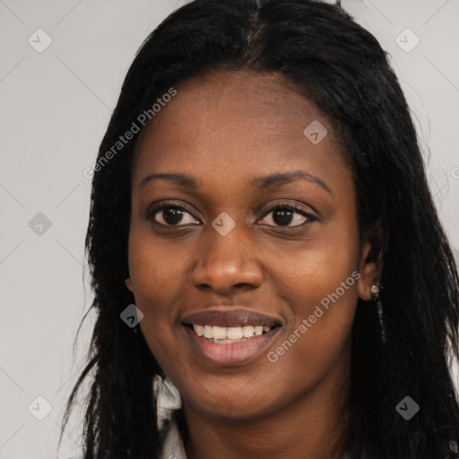 Joyful black young-adult female with long  black hair and brown eyes
