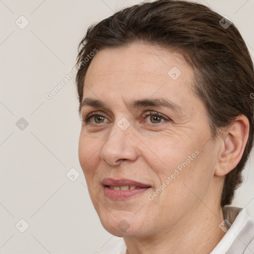 Joyful white adult female with short  brown hair and brown eyes