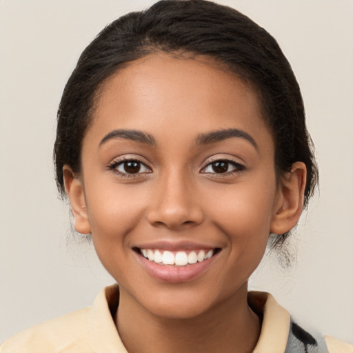 Joyful latino young-adult female with medium  brown hair and brown eyes