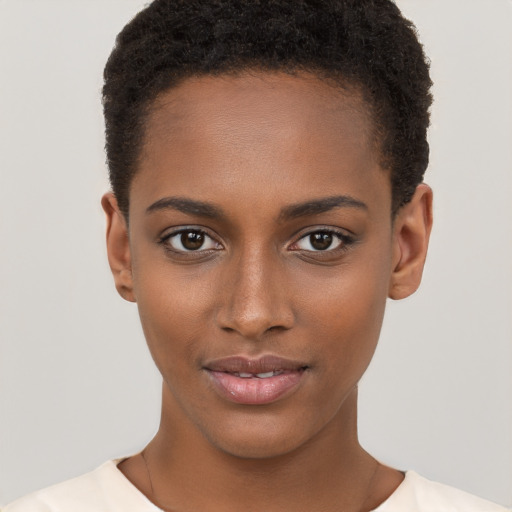 Joyful black young-adult female with short  brown hair and brown eyes