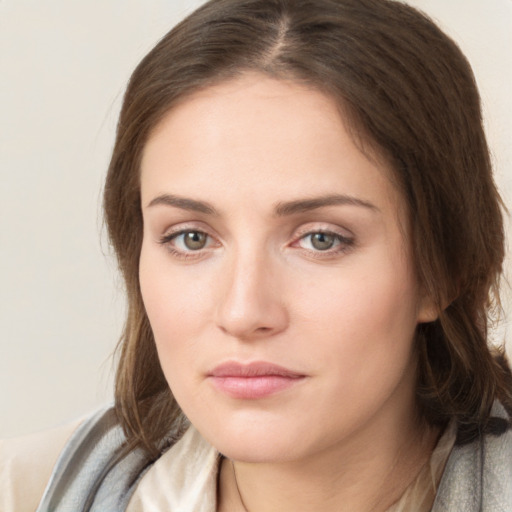 Neutral white young-adult female with medium  brown hair and grey eyes