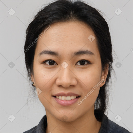 Joyful asian young-adult female with medium  black hair and brown eyes