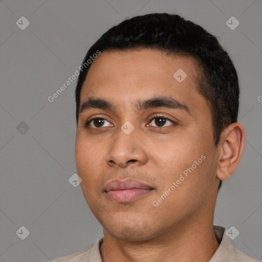 Neutral latino young-adult male with short  black hair and brown eyes