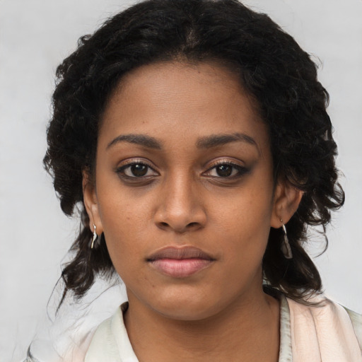 Neutral black young-adult female with long  brown hair and brown eyes