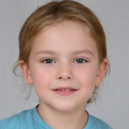 Joyful white child female with medium  brown hair and brown eyes