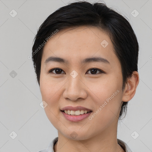 Joyful asian young-adult female with medium  brown hair and brown eyes