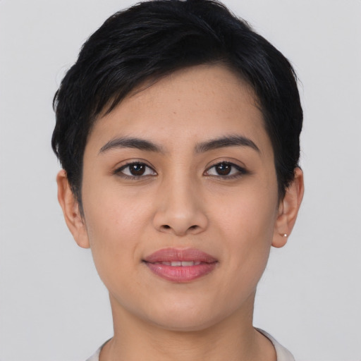Joyful asian young-adult female with short  black hair and brown eyes