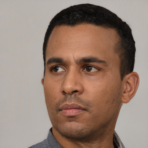 Neutral latino adult male with short  black hair and brown eyes