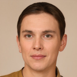 Joyful white young-adult male with short  brown hair and brown eyes