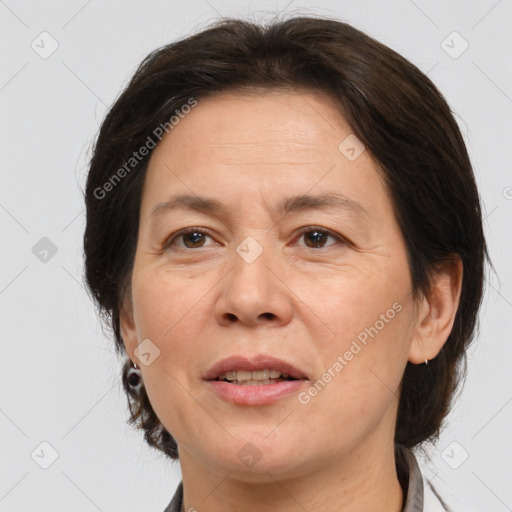 Joyful white adult female with medium  brown hair and brown eyes