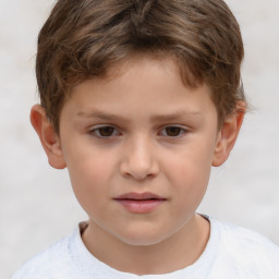 Joyful white child male with short  brown hair and brown eyes