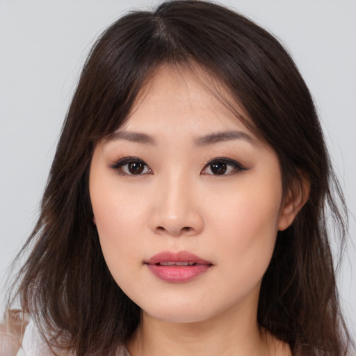 Neutral asian young-adult female with medium  brown hair and brown eyes