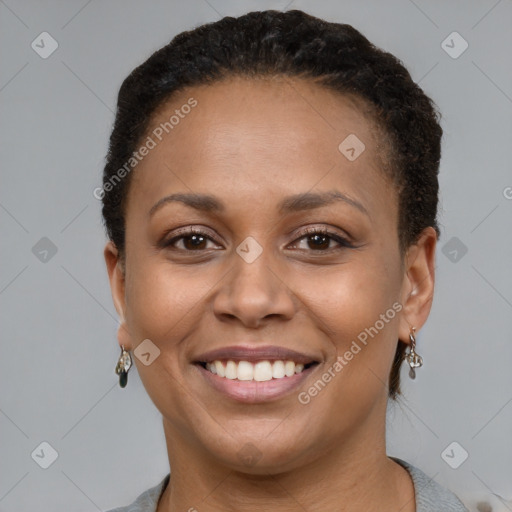 Joyful latino young-adult female with short  brown hair and brown eyes