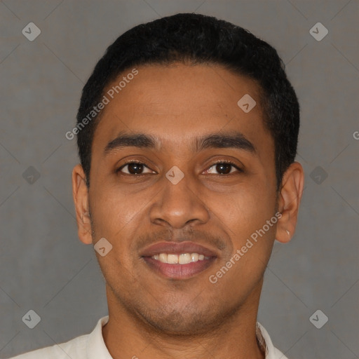 Joyful latino young-adult male with short  black hair and brown eyes