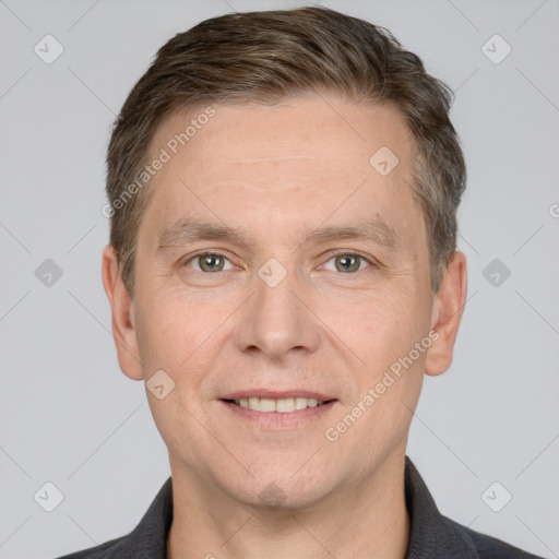 Joyful white adult male with short  brown hair and grey eyes