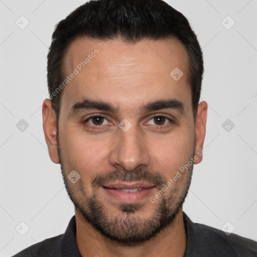 Joyful white young-adult male with short  black hair and brown eyes