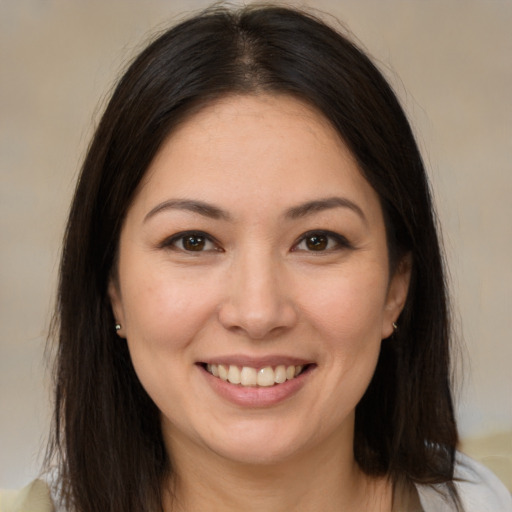 Joyful white young-adult female with medium  brown hair and brown eyes