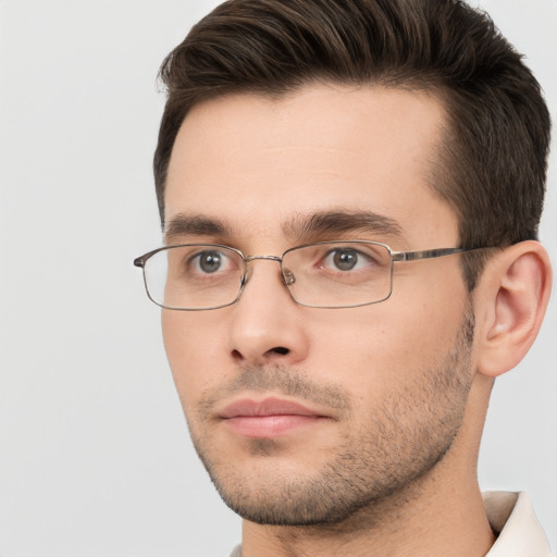 Neutral white young-adult male with short  brown hair and brown eyes