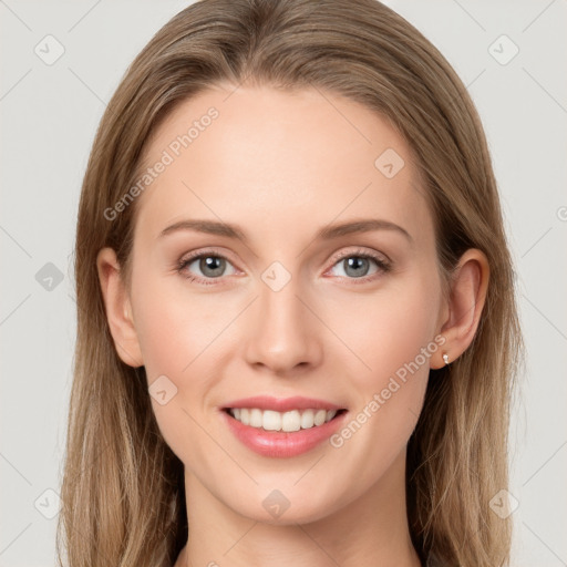 Joyful white young-adult female with long  brown hair and blue eyes