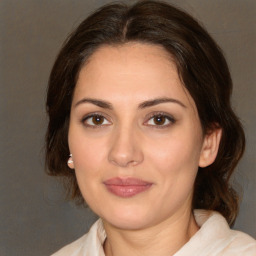 Joyful white young-adult female with medium  brown hair and brown eyes