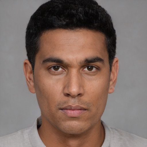 Neutral latino young-adult male with short  black hair and brown eyes