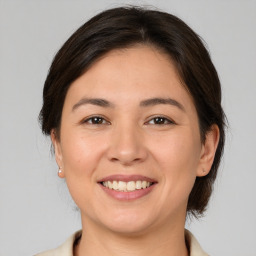 Joyful white young-adult female with medium  brown hair and brown eyes