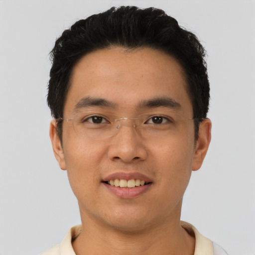 Joyful asian young-adult male with short  black hair and brown eyes