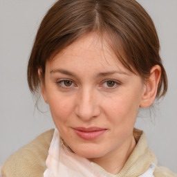 Joyful white adult female with medium  brown hair and brown eyes