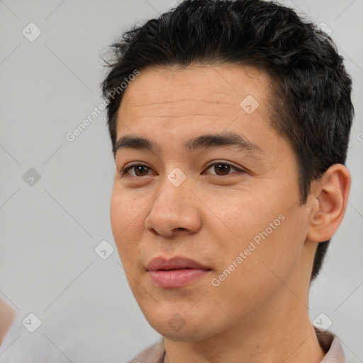 Joyful asian young-adult male with short  black hair and brown eyes