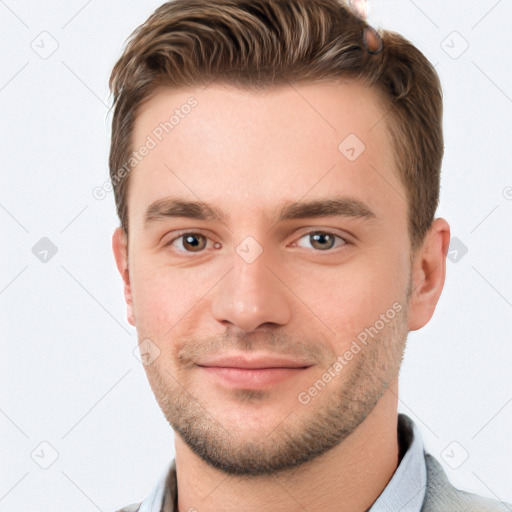 Joyful white young-adult male with short  brown hair and grey eyes