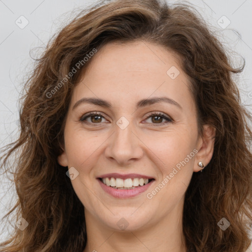 Joyful white adult female with long  brown hair and brown eyes