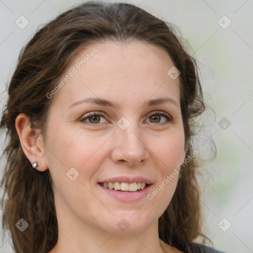 Joyful white young-adult female with medium  brown hair and green eyes