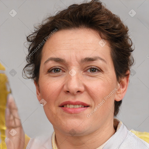 Joyful white adult female with short  brown hair and brown eyes