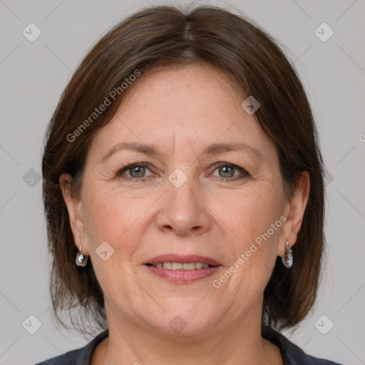 Joyful white adult female with medium  brown hair and grey eyes