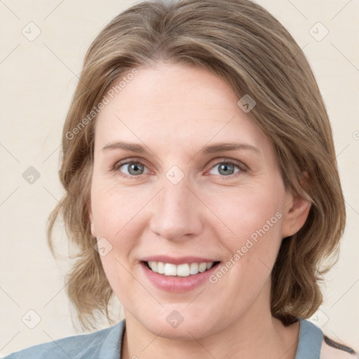 Joyful white young-adult female with medium  brown hair and blue eyes