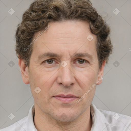 Joyful white adult male with short  brown hair and grey eyes