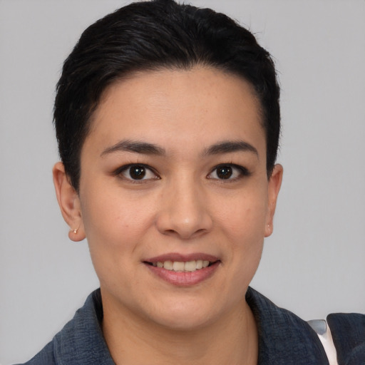 Joyful asian young-adult female with short  black hair and brown eyes