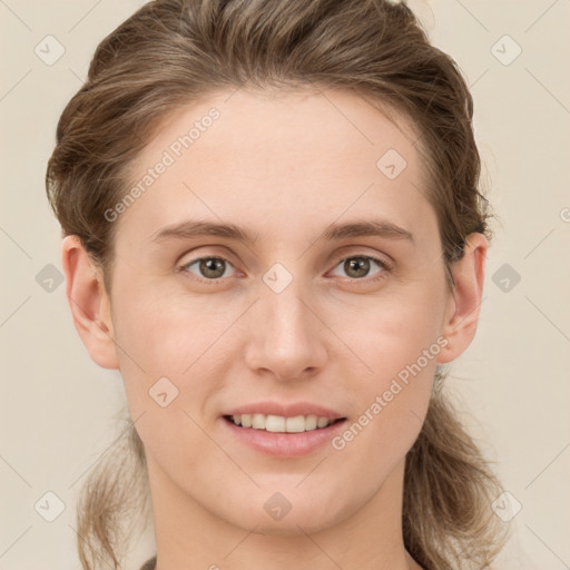 Joyful white young-adult female with medium  brown hair and grey eyes